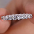 Avideri engagement band featuring a white gold band with round diamonds.
