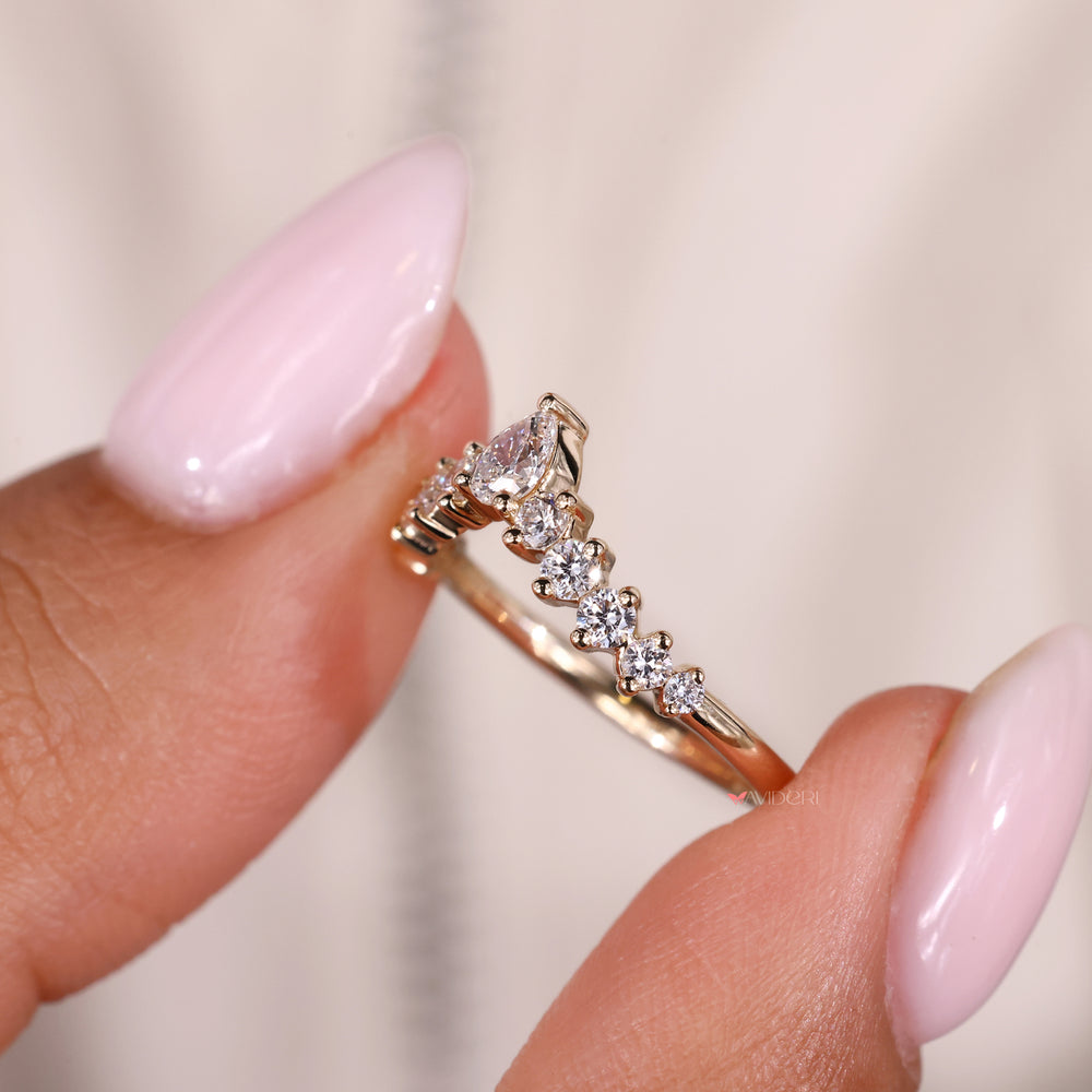 Avideri engagement ring with pear shaped diamond band for an elegant design.
