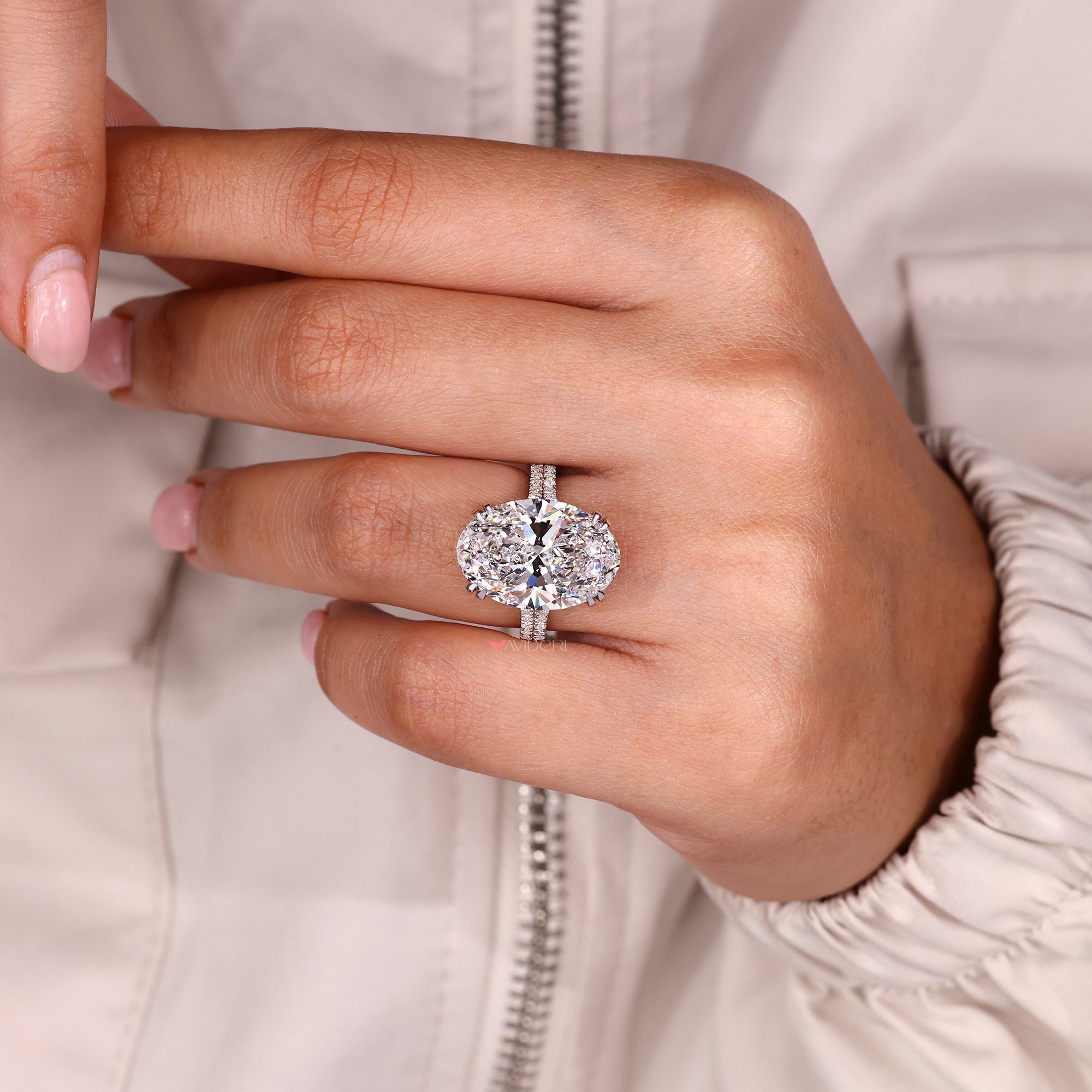 Oval lab grown diamond ring with double row pave band design.