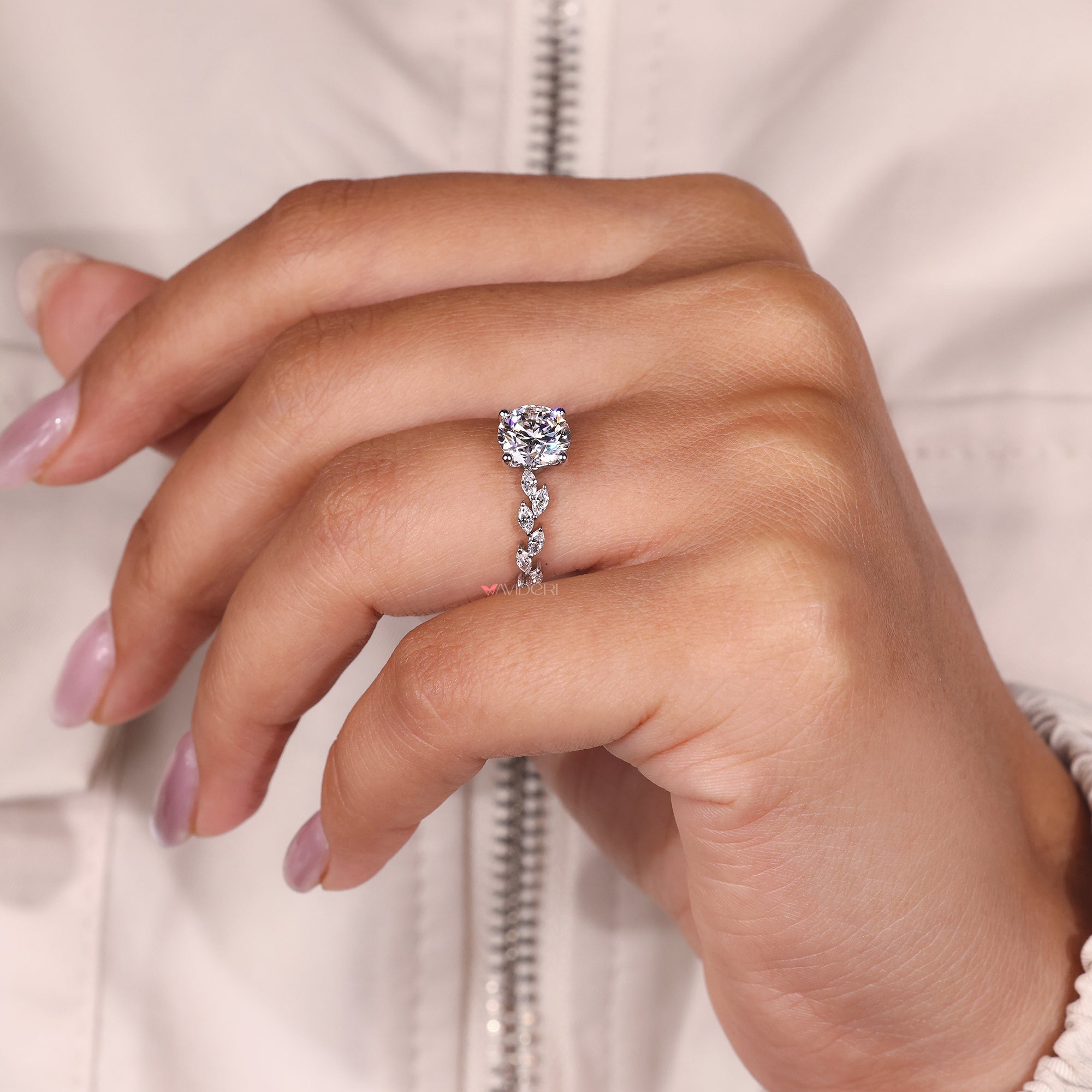 Custom engagement ring with a round diamond, tailored for a personalized touch.