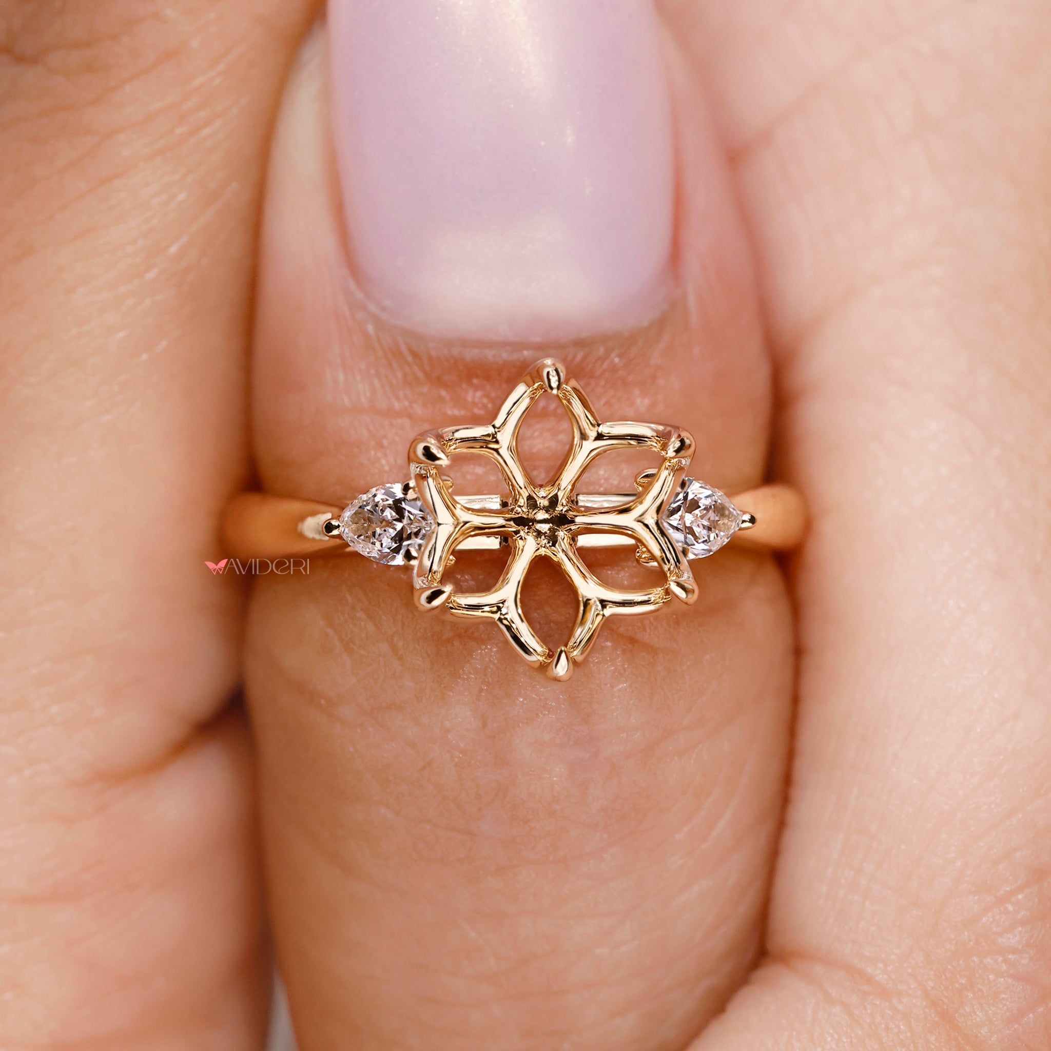 Lab grown diamond ring with a pink peekaboo setting and tapered shank.
