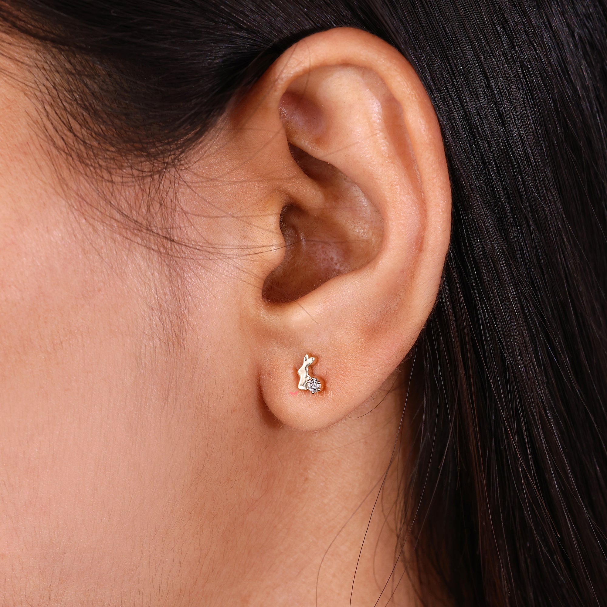 Stud diamond earrings in a rabbit shape.
