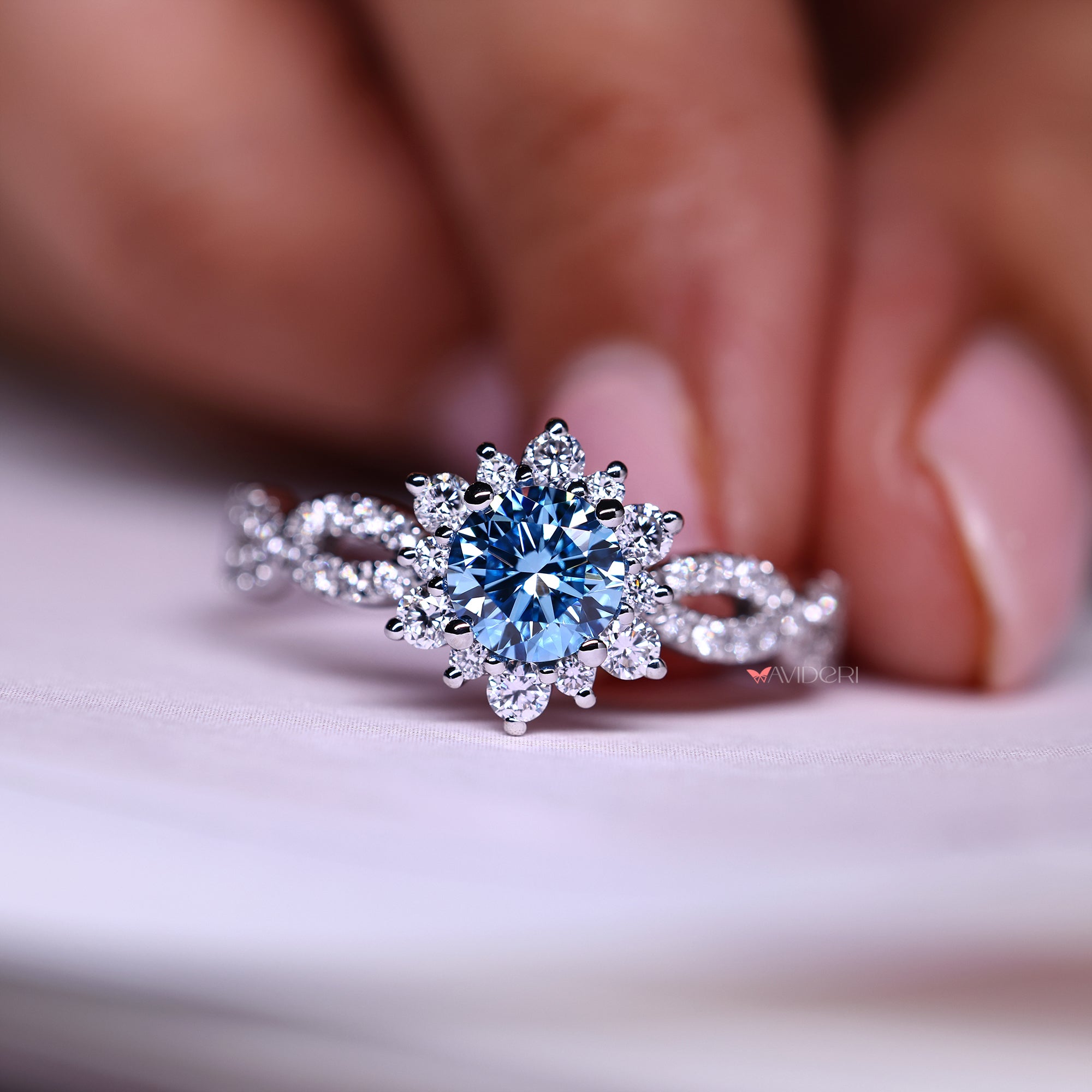 Buy engagement ring with round cut halo detail.
