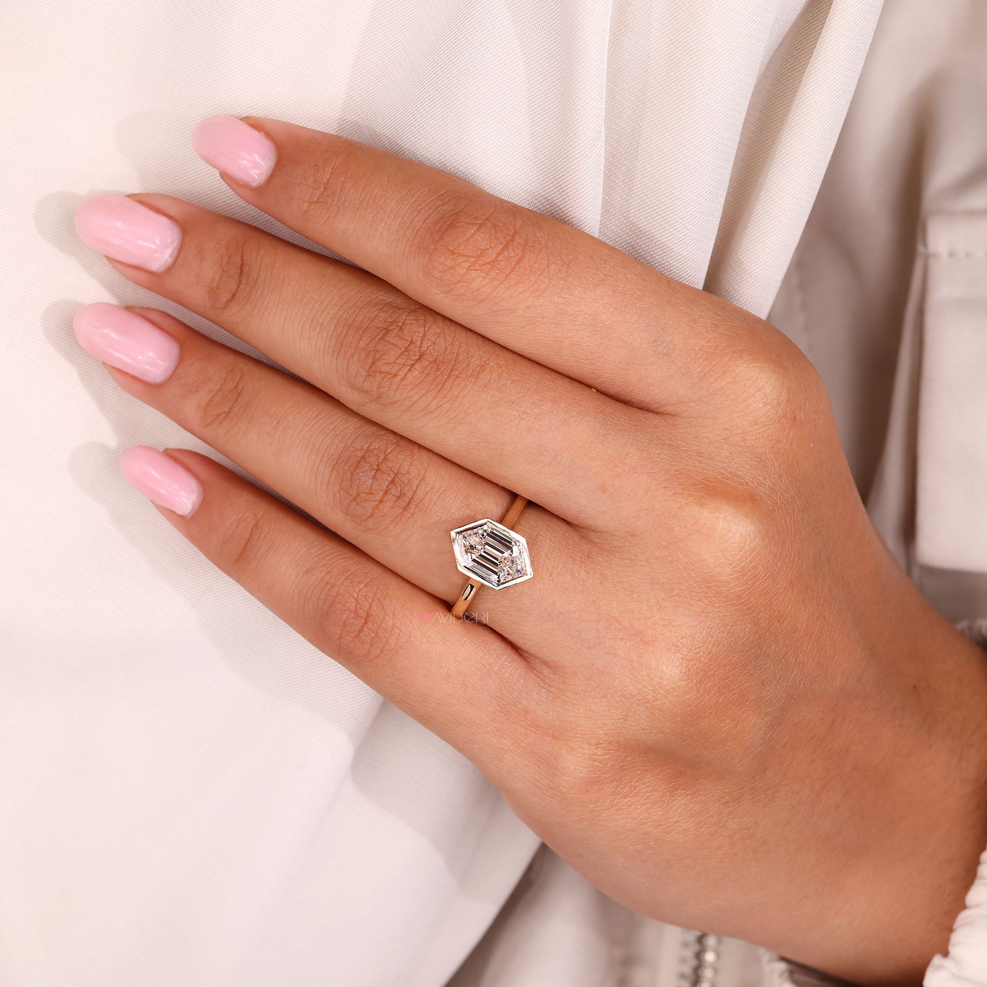 Cathedral setting ring with custom hexagon diamond.