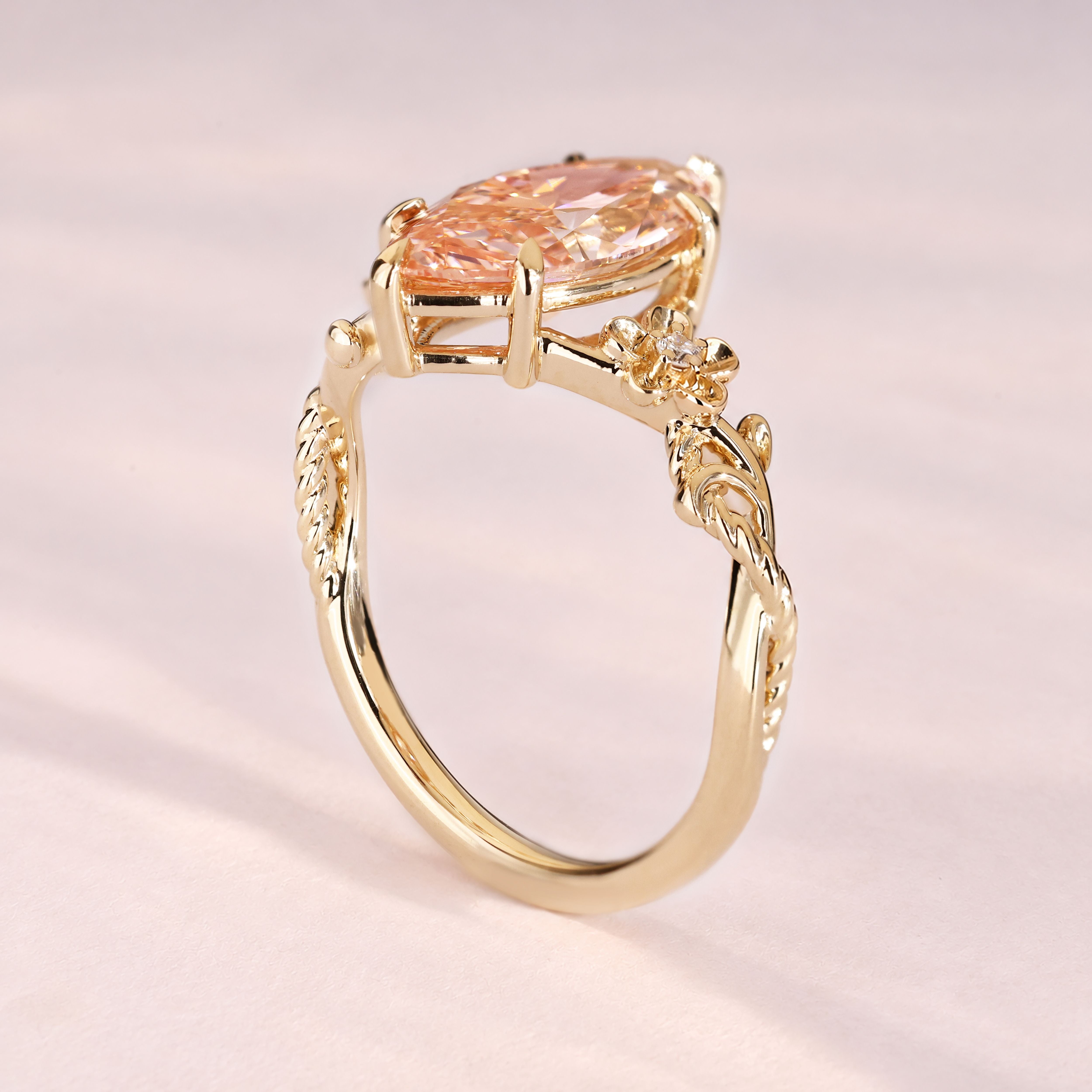 Lab grown pink marquise diamond ring with floral design.
