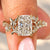 Cushion cut diamond ring with round diamond pave.
