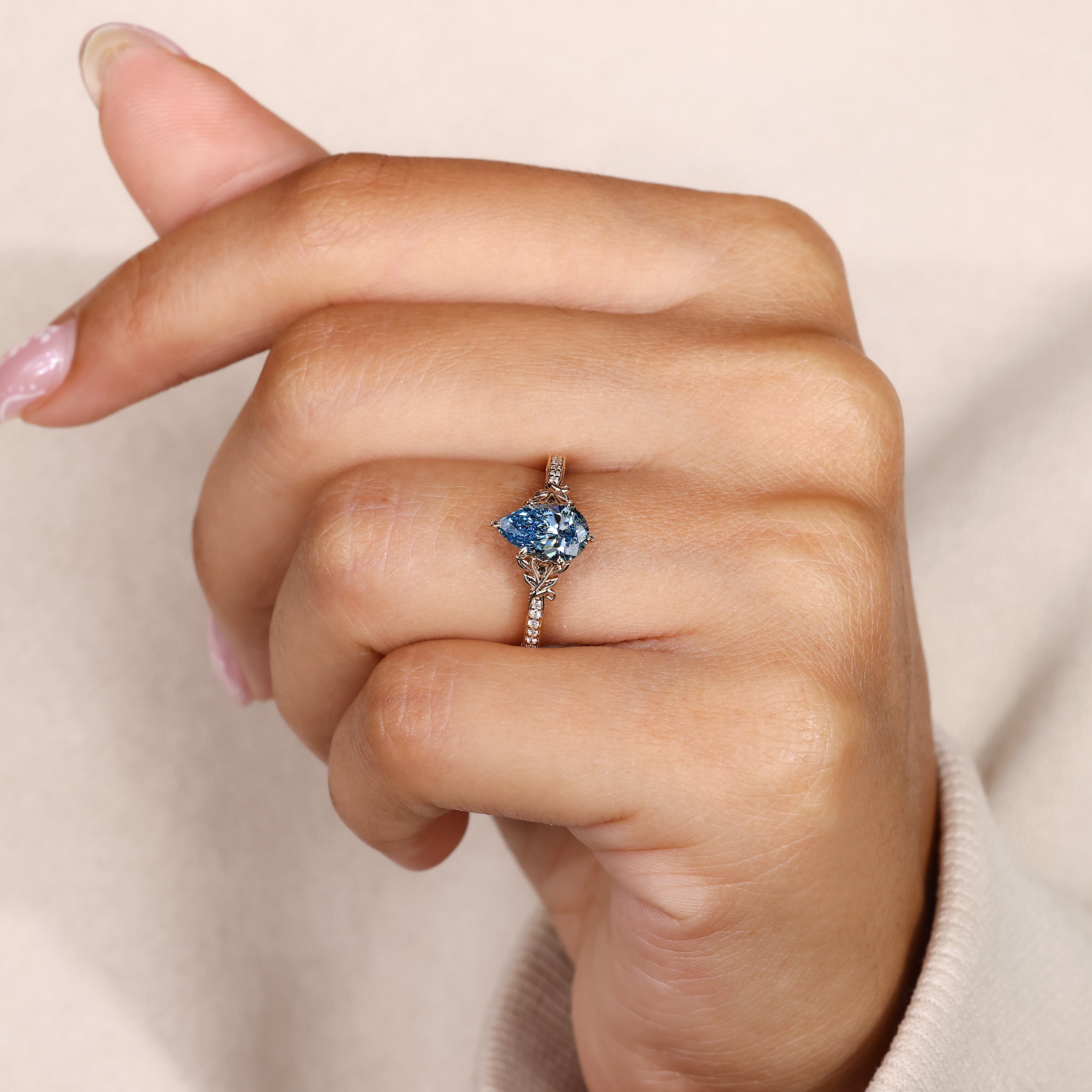 Nature inspired pear cut diamond ring with filigree.
