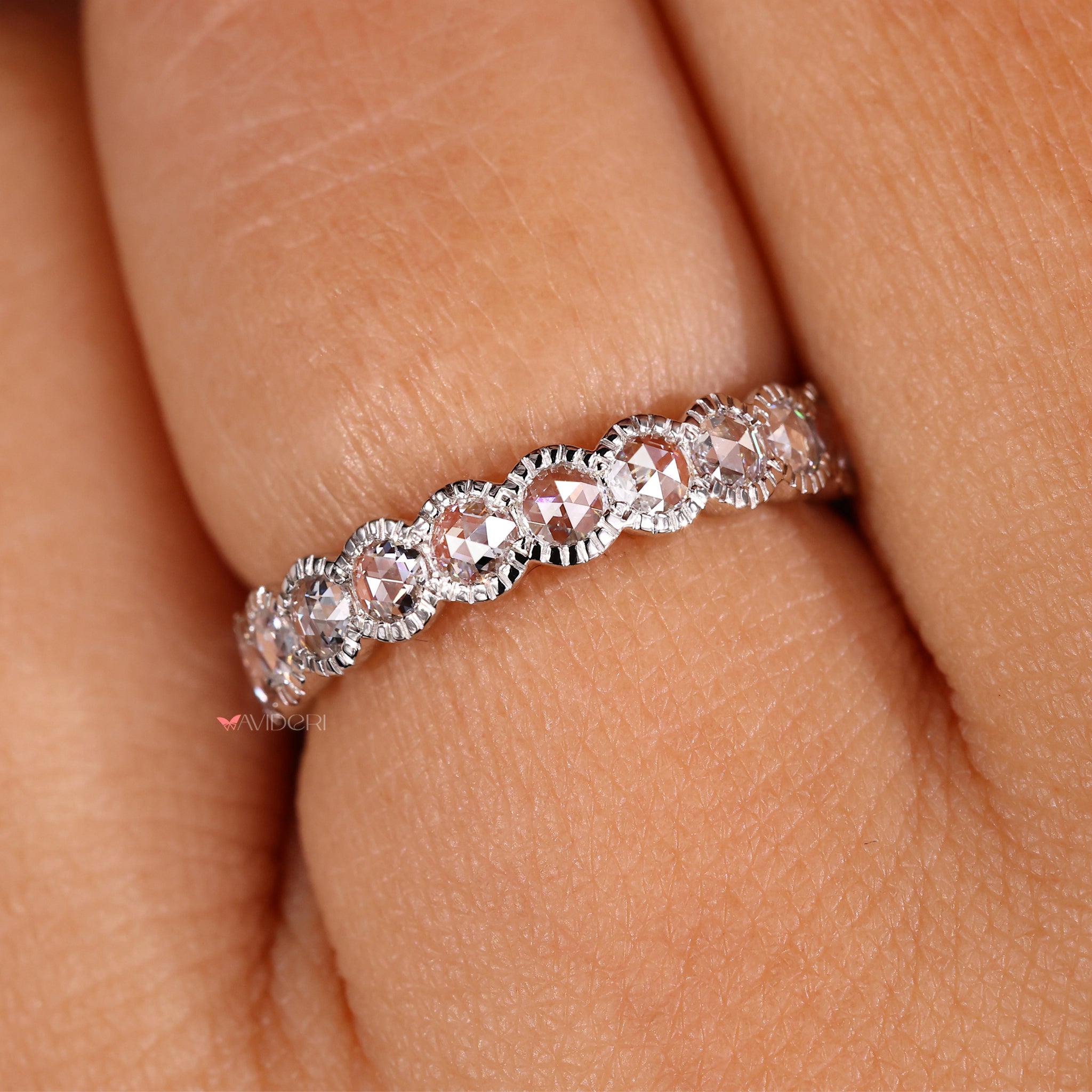 Half eternity band featuring a milgrain wedding band with round diamonds.
