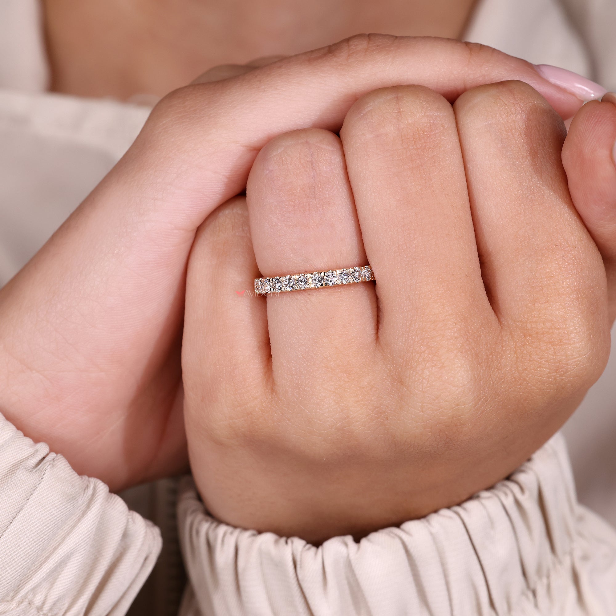 Lab grown diamond prong set eternity band.
