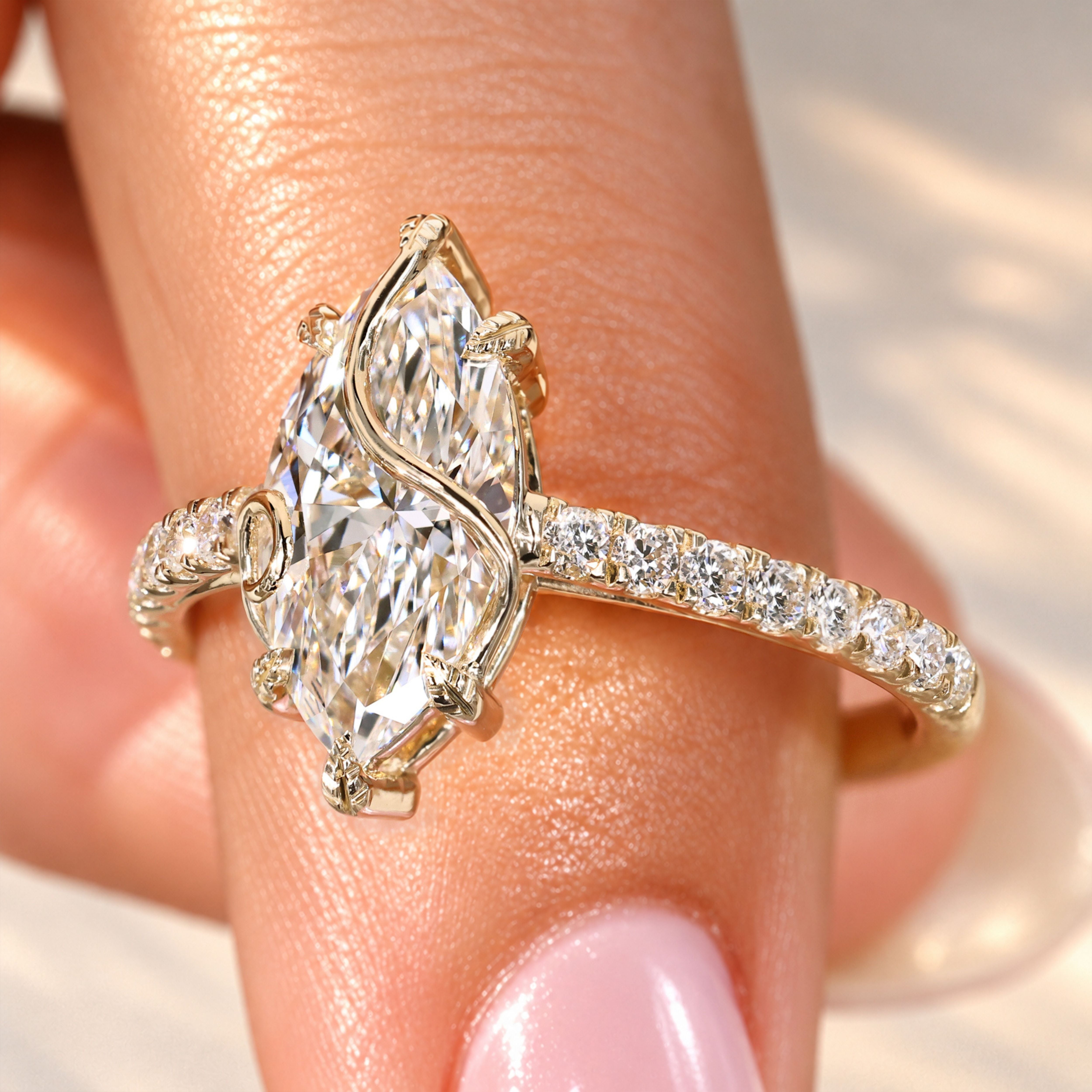Marquise diamond ring with round diamond pave.
