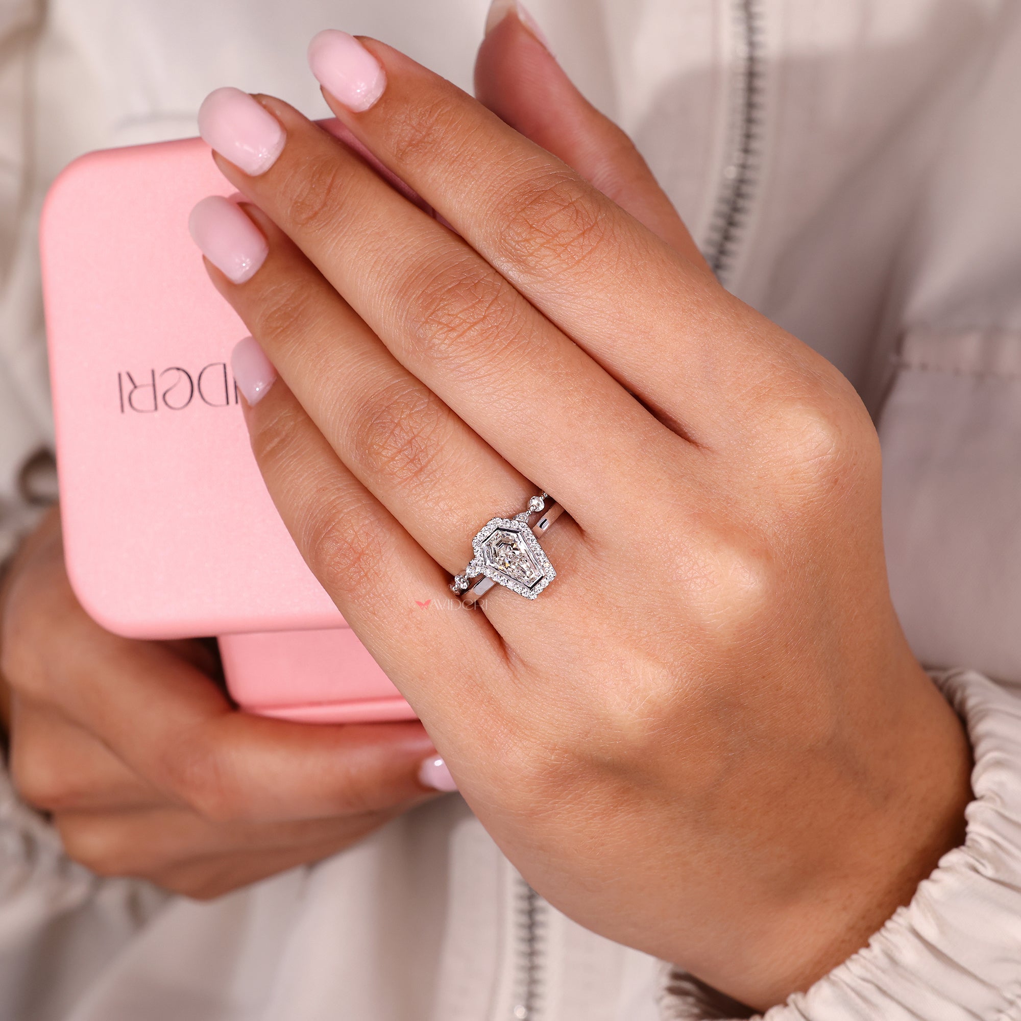 Coffin cut engagement ring with a matching band.