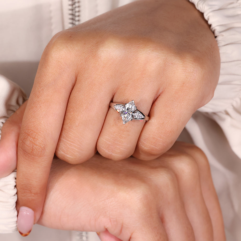 3-stone marquise and pear diamond engagement ring.