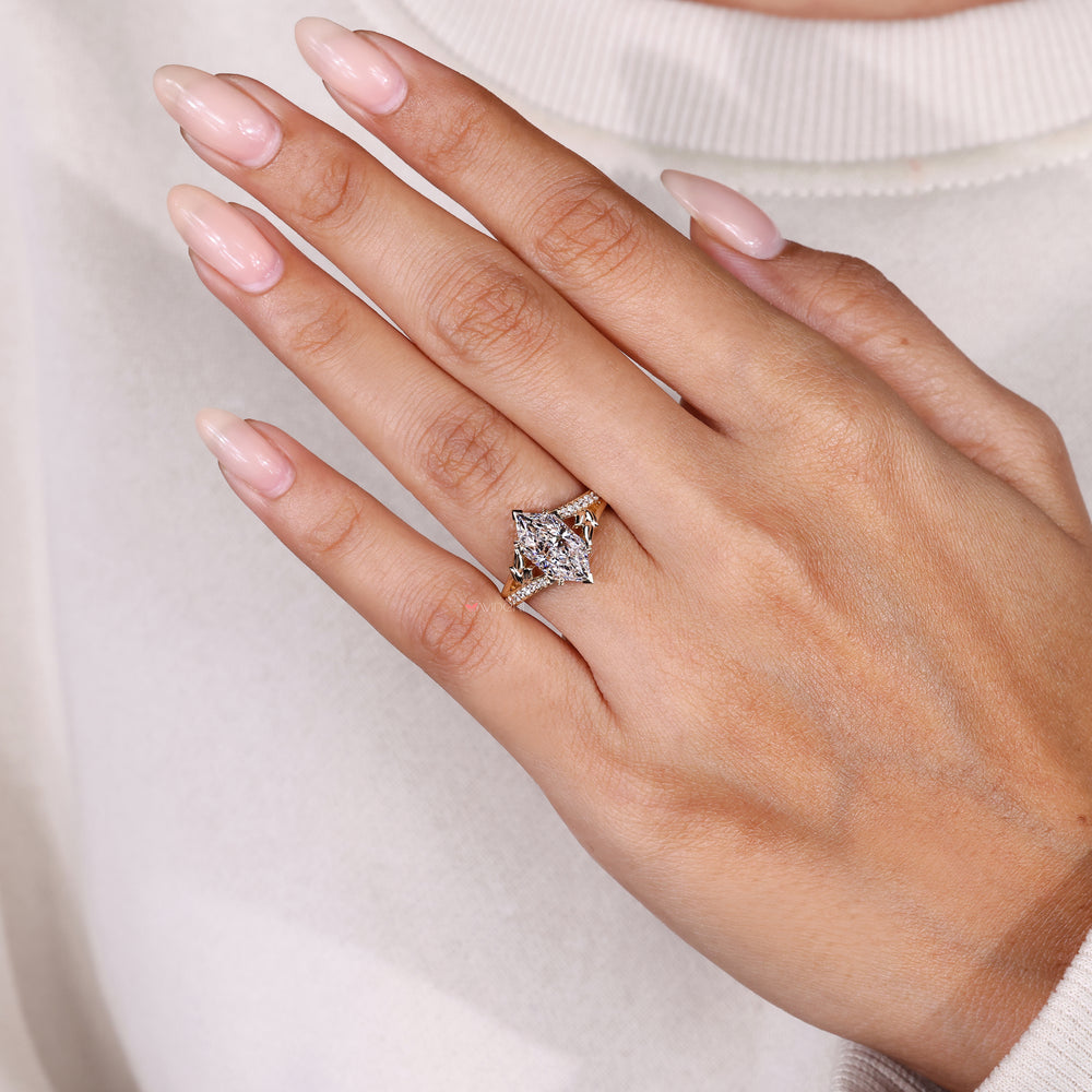 Nature inspired marquise ring with leaf prongs.
