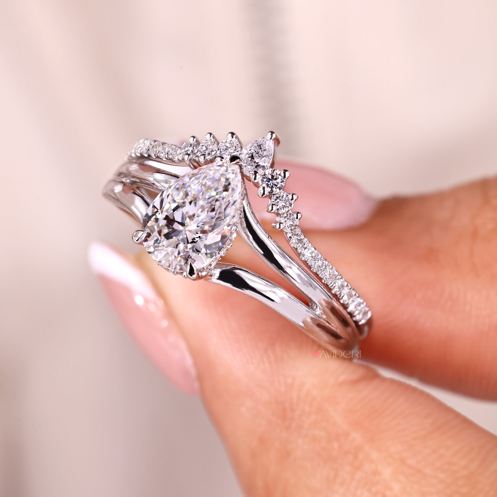 Pear cut wedding band on chevron wedding band.