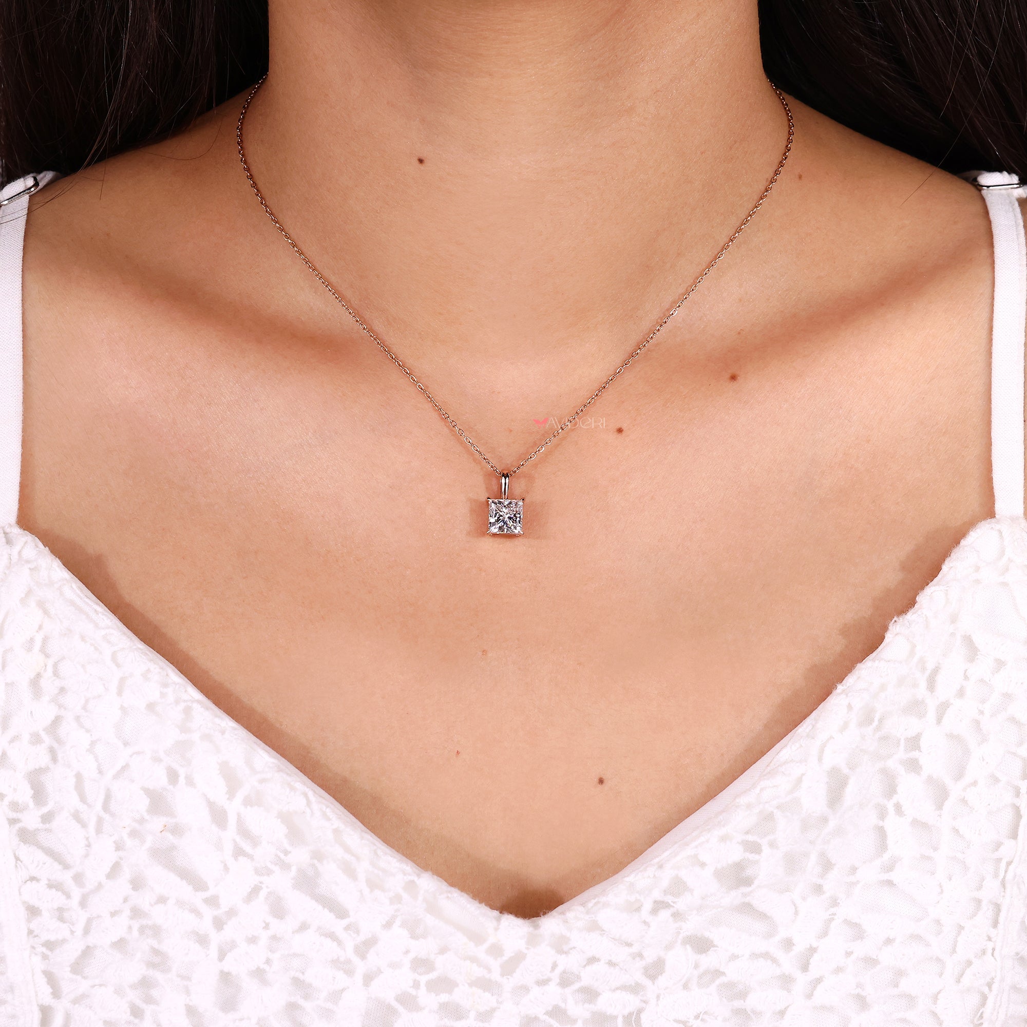 Solitaire pendant with princess solitaire pendant.