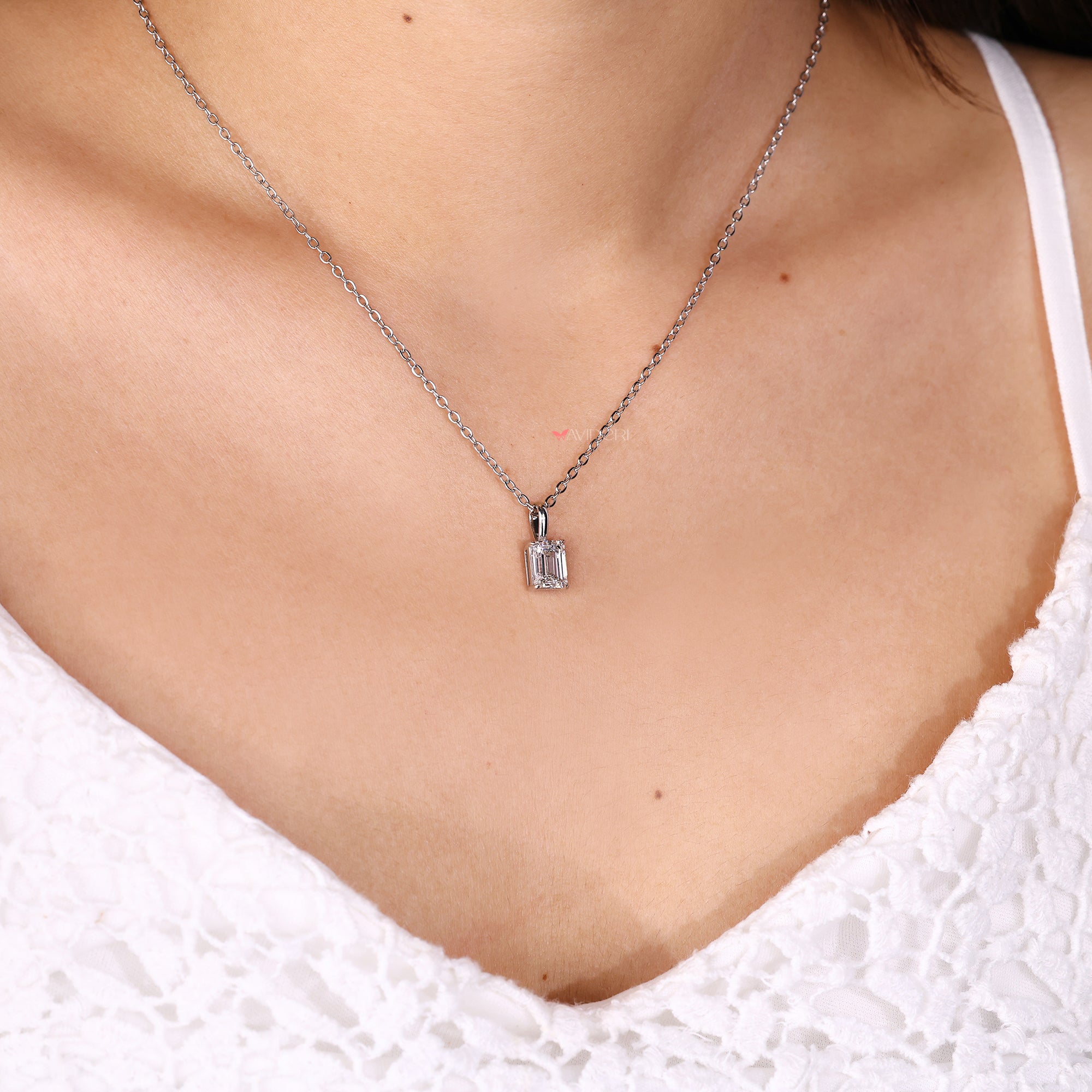 Avideri pendant designed with emerald cut solitaire diamond.