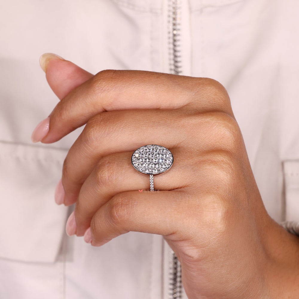 Handmade cluster diamond ring with oval shaped design outline.
