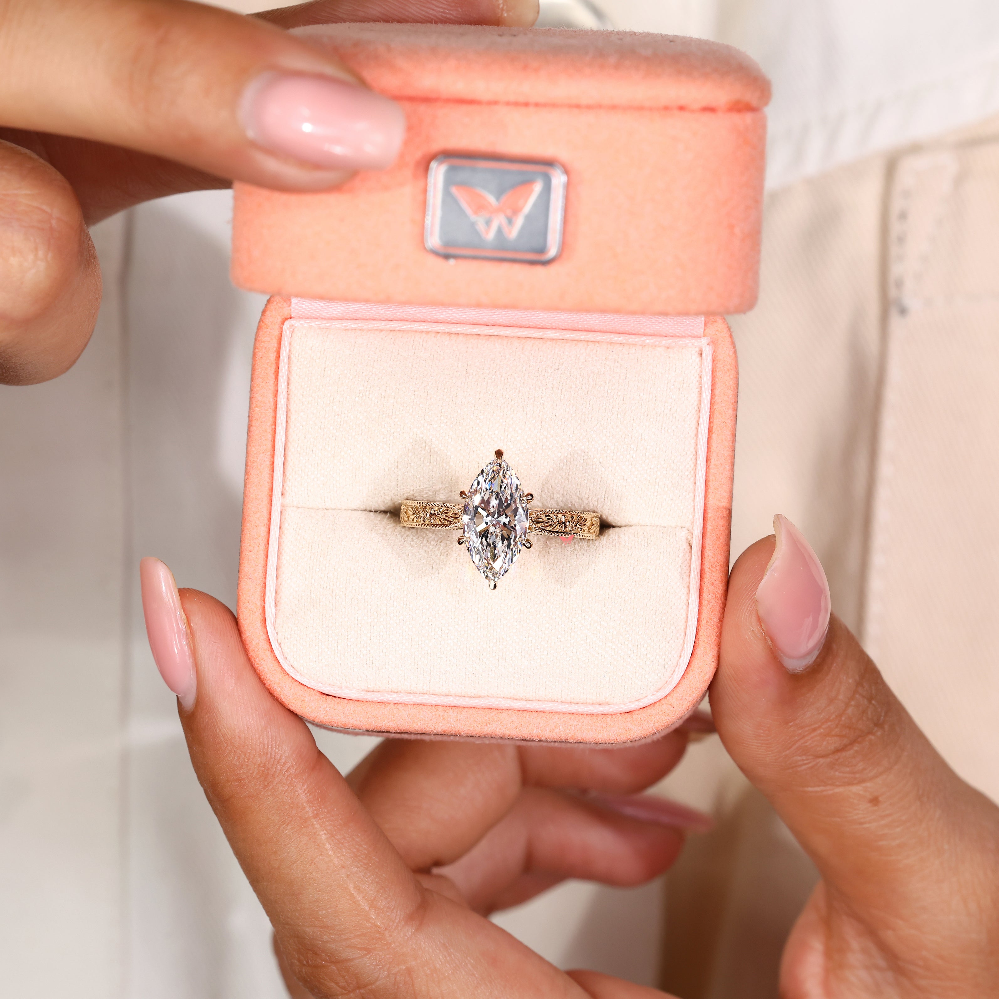 Solitaire marquise diamond ring with six claw prong setting
