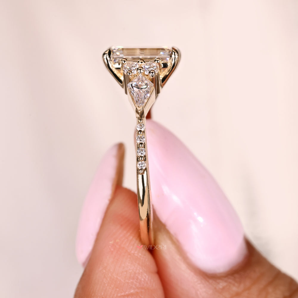 Handmade emerald cut diamond ring with four claw prongs
