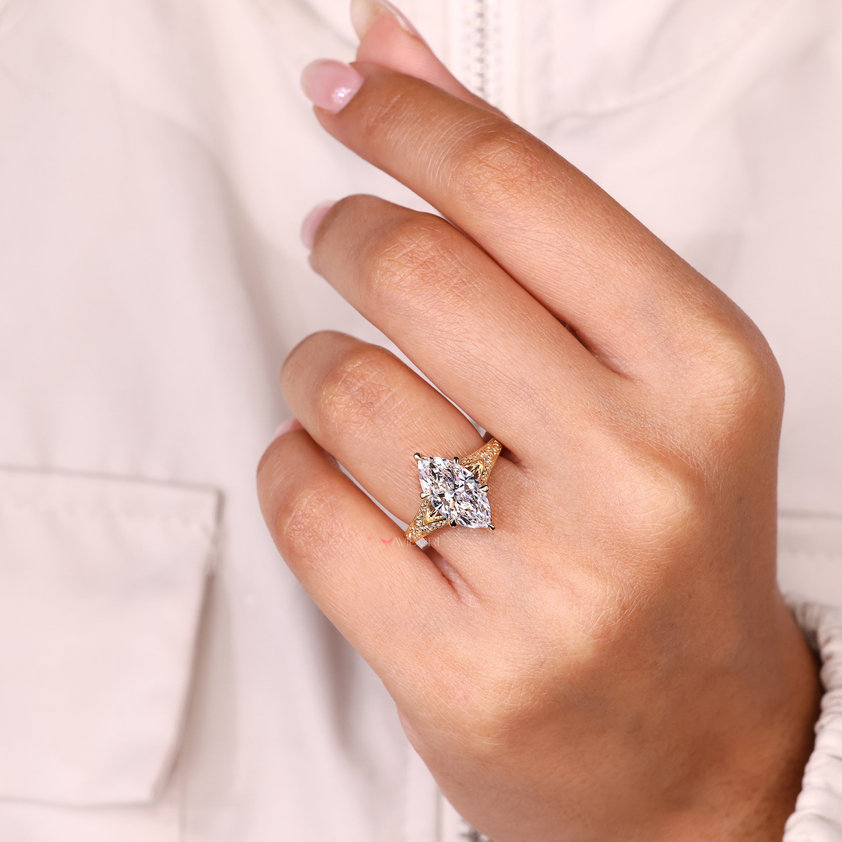 Marquise solitaire ring with cathedral design.
