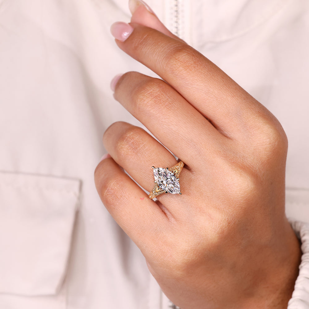 Marquise solitaire ring with cathedral design.
