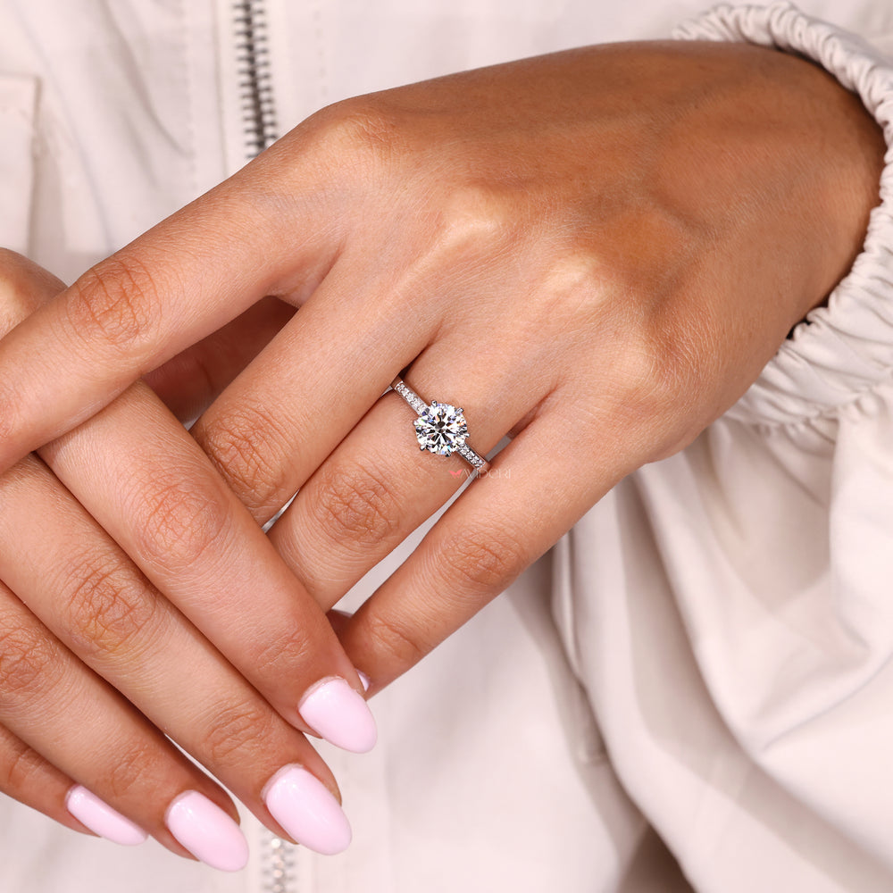 Round diamond engagement ring with six prongs and pave
