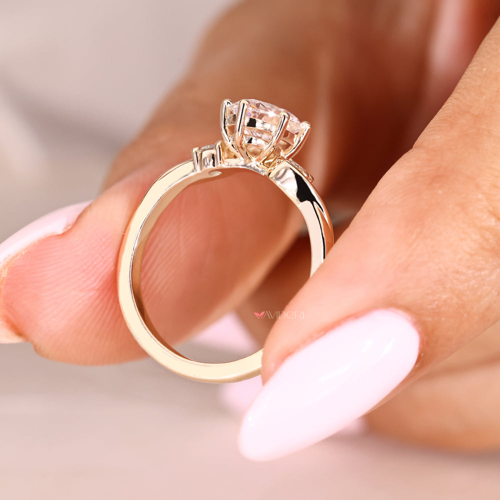 Oval diamond engagement ring with round side stone accents
