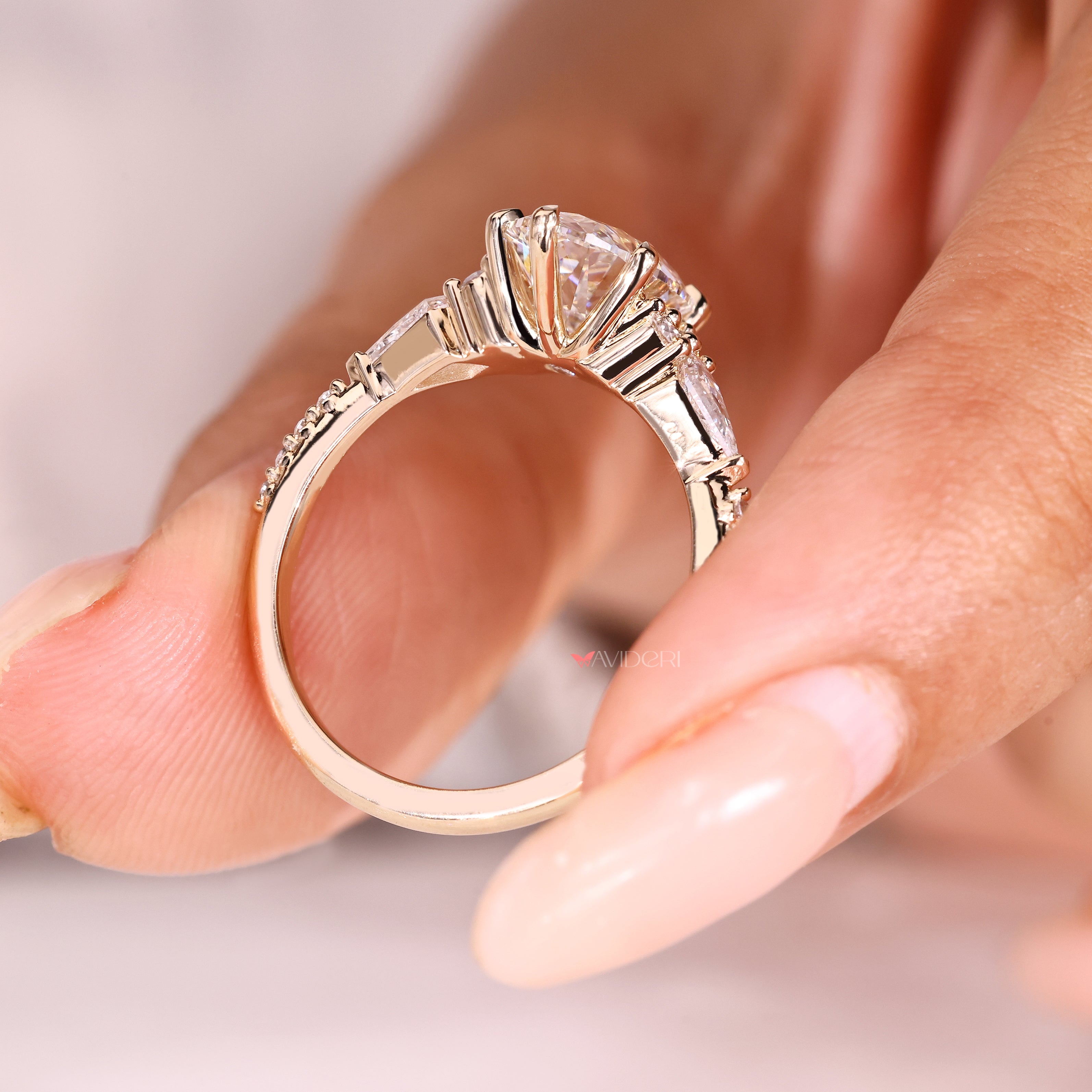 Six claw prong oval diamond ring with side stones
