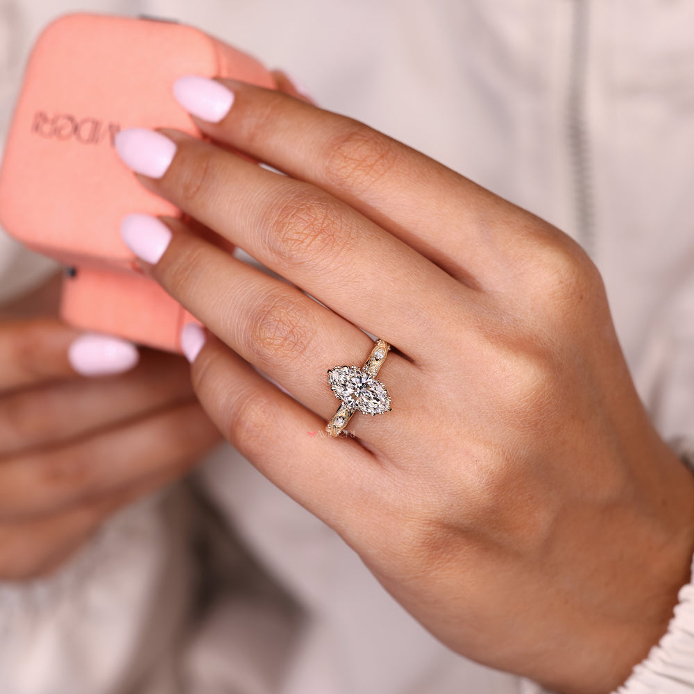 Lab grown marquise ring with round accents and hidden halo
