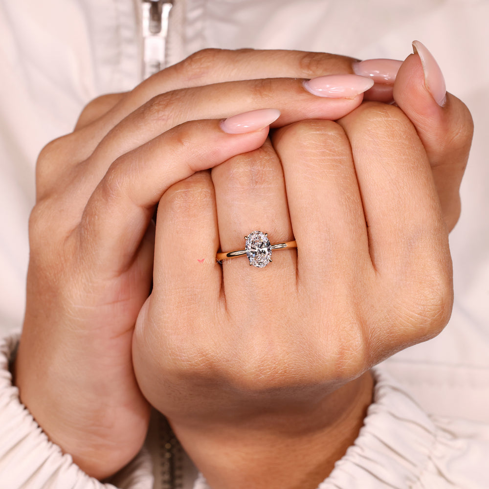 Handmade oval diamond ring hidden halo style.
