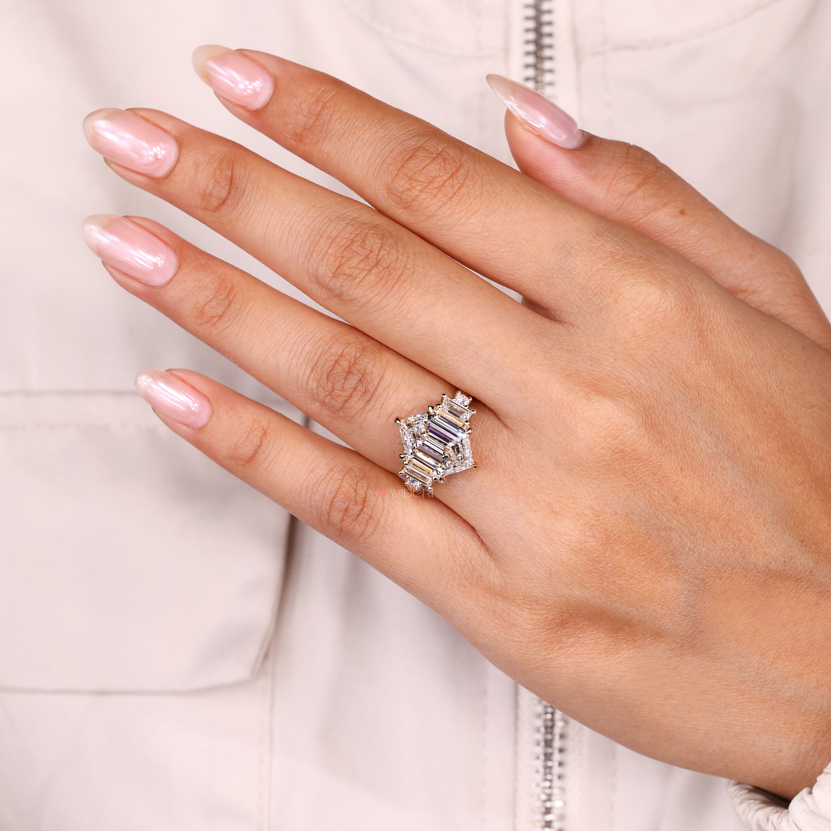 Lab grown diamond hexagon ring five stone style.
