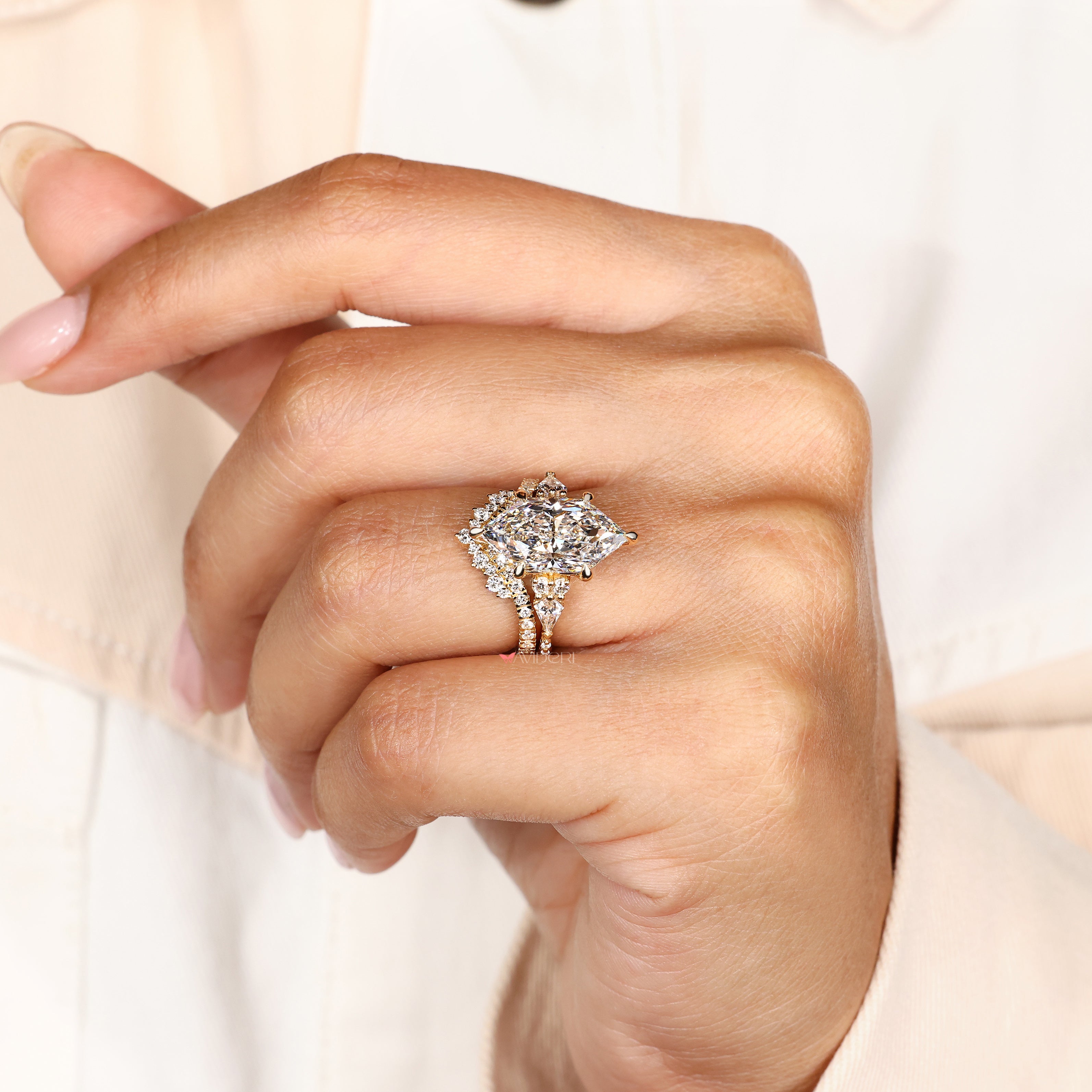 Muse setting marquise ring with six claw prongs.
