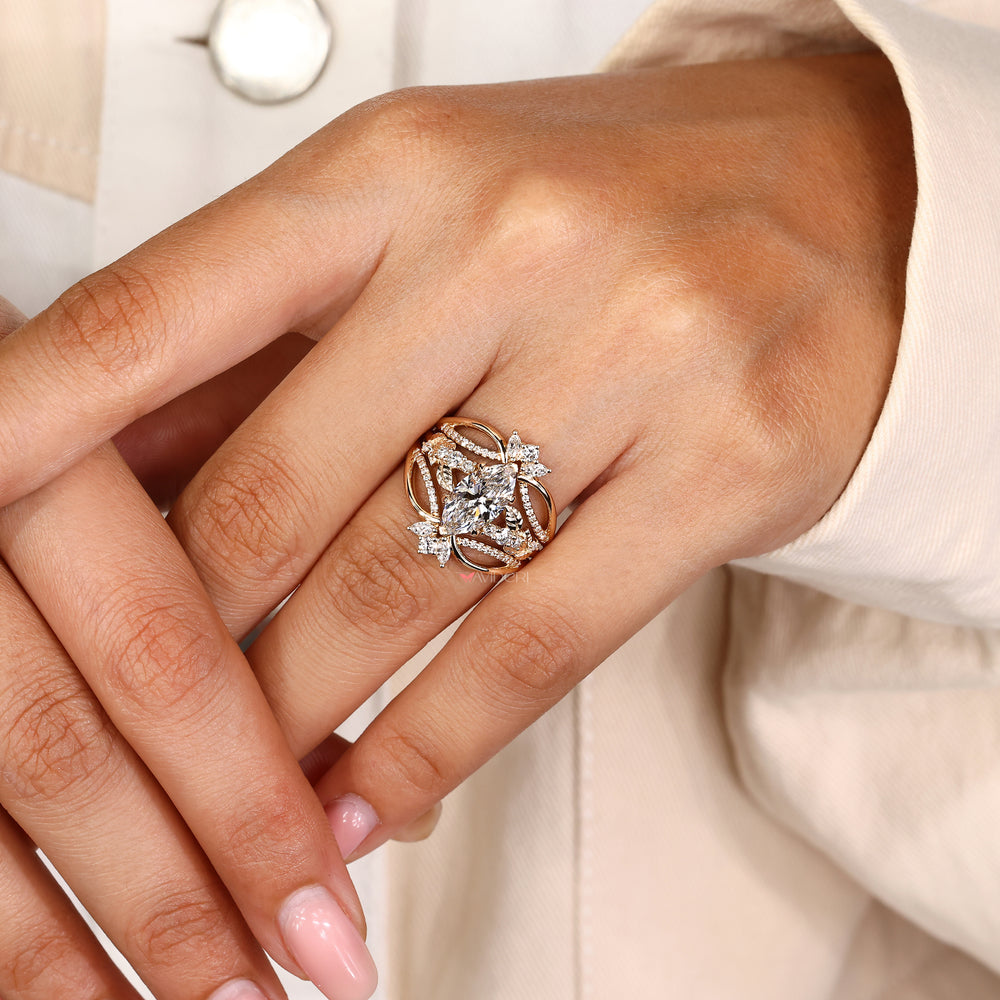 Marquise diamond ring with round side stone accents
