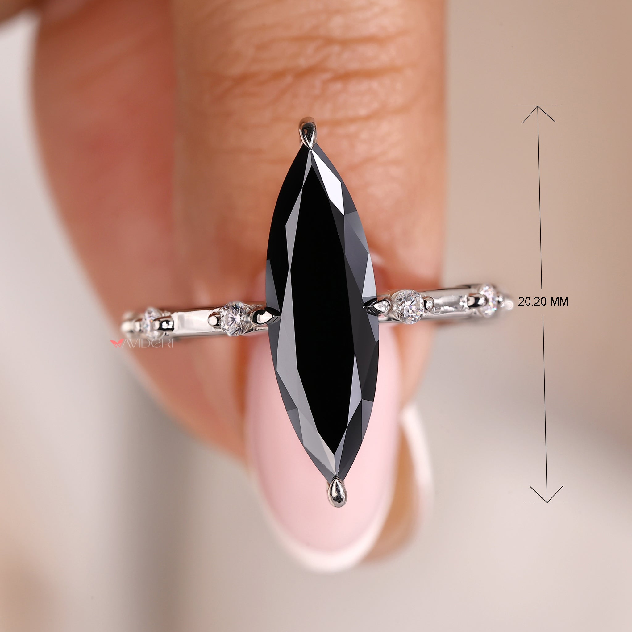 Compass prong ring highlighting a brilliant moissanite.