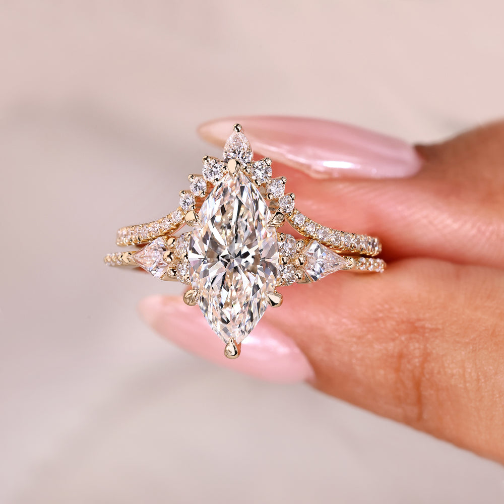 Marquise ring with kite side stones and band.
