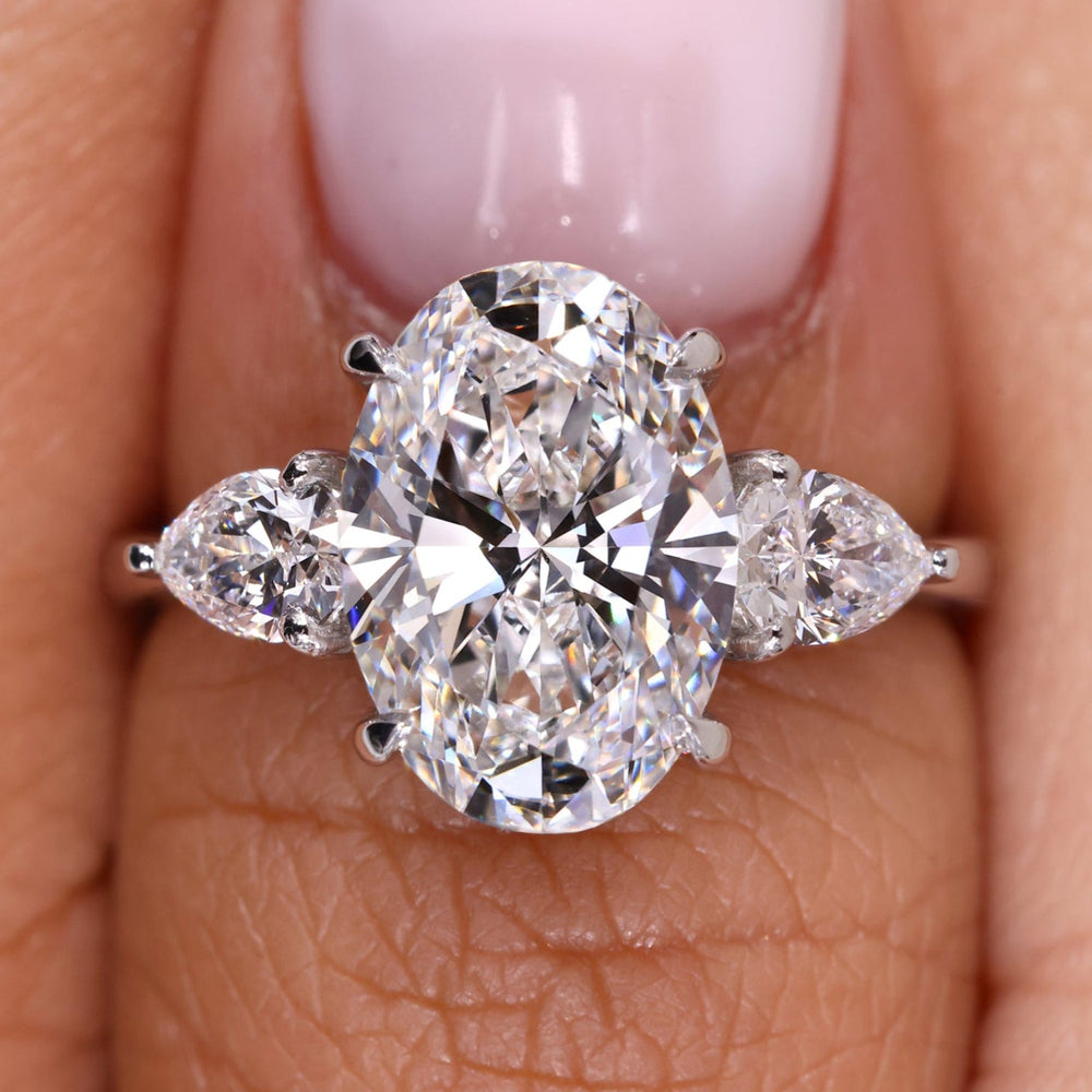 Three stone oval engagement ring featuring a stunning diamond ring oval design.
