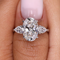 Three Stone Oval Engagement Ring – Pear Side Stones
