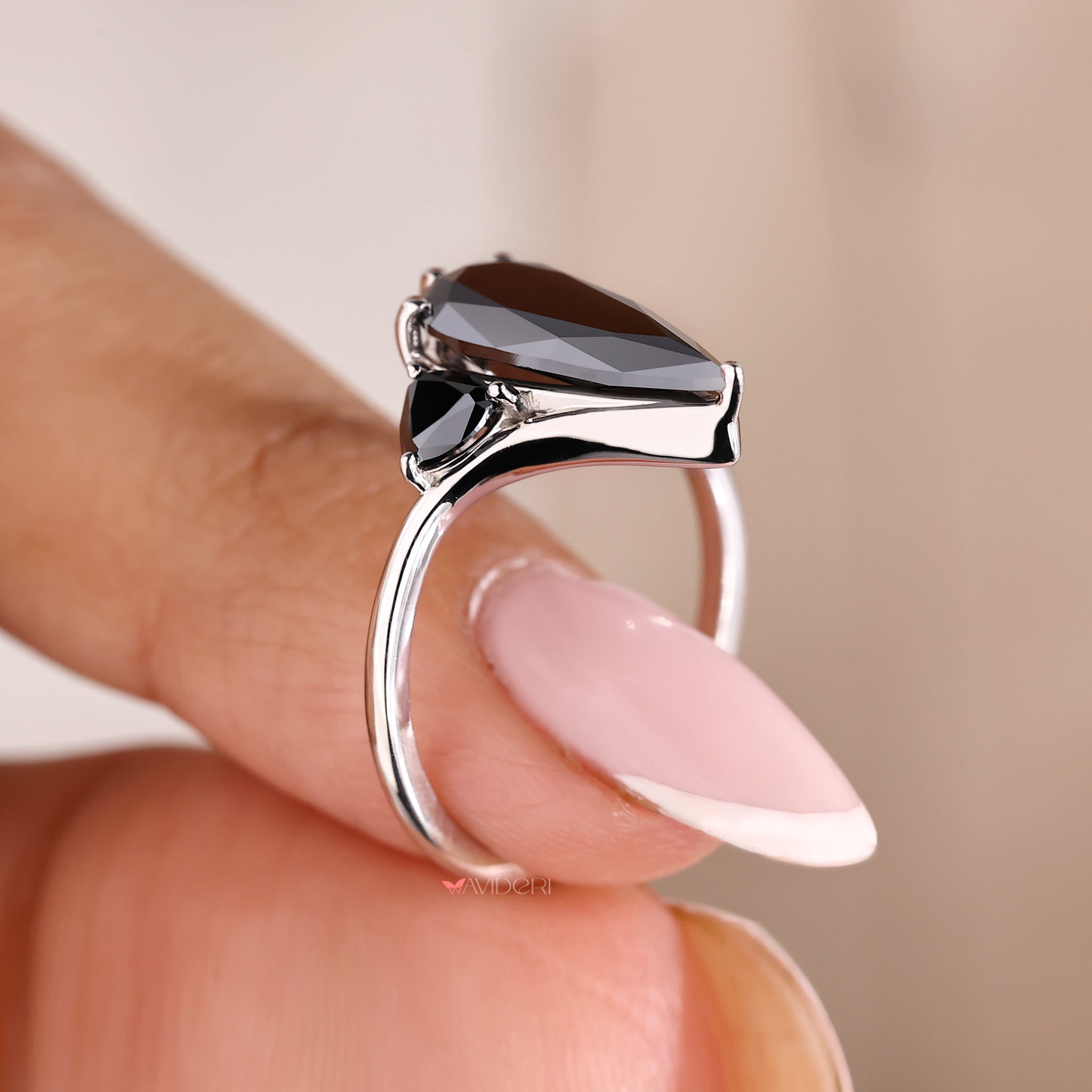 White gold engagement ring with moissanite accents.
