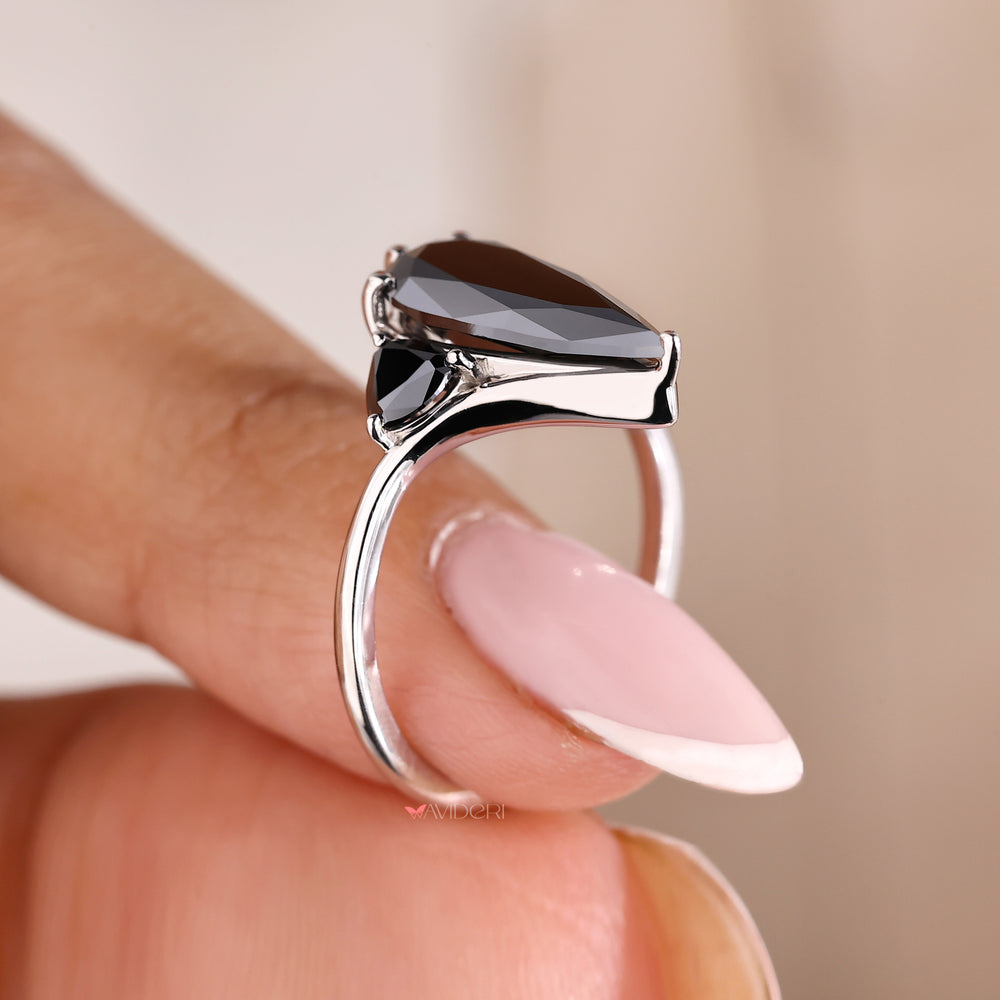 White gold engagement ring with moissanite accents.