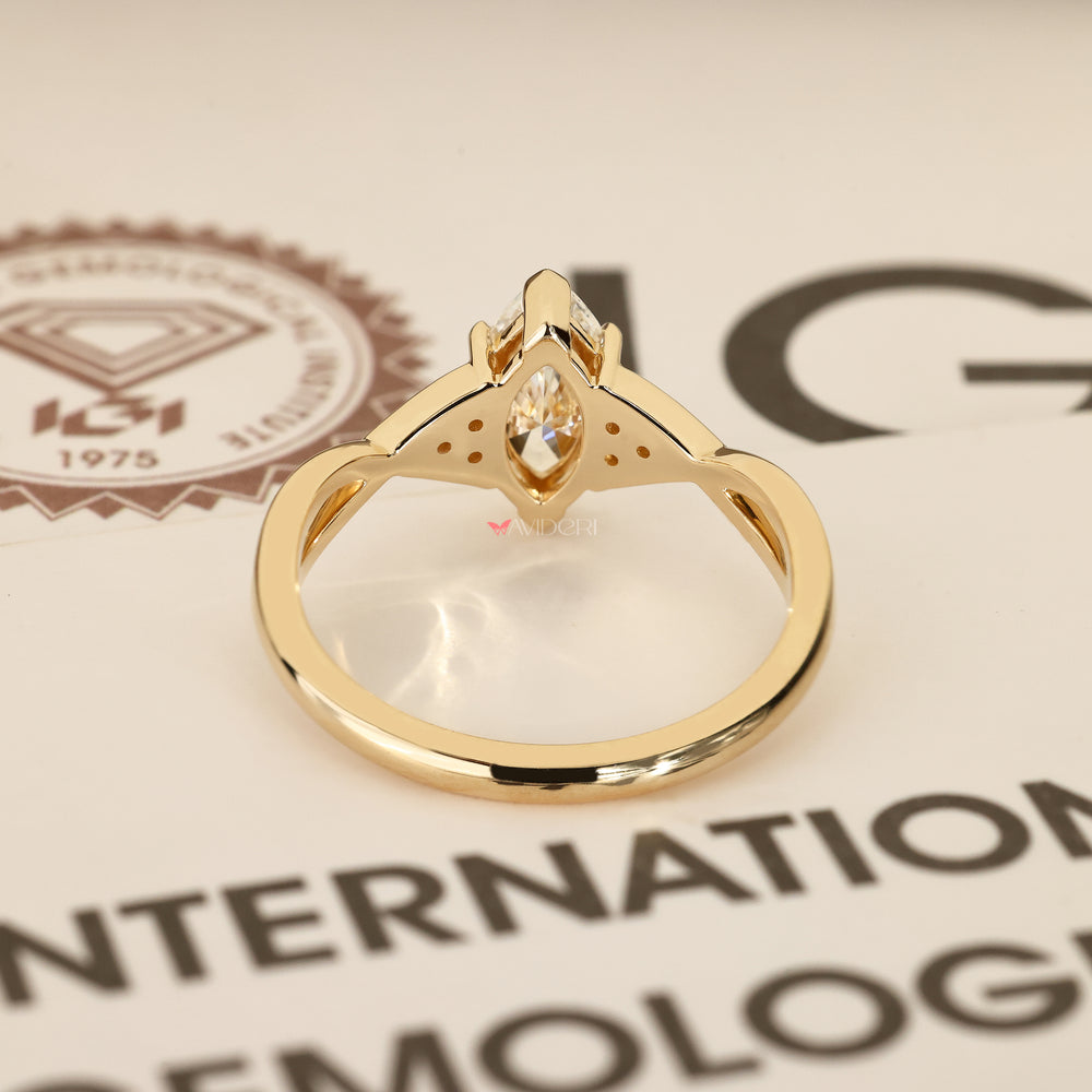 Handmade marquise diamond ring with claw prongs.
