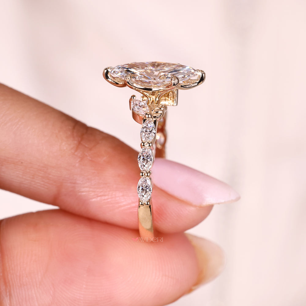 Marquise ring with pave setting cathedral style.
