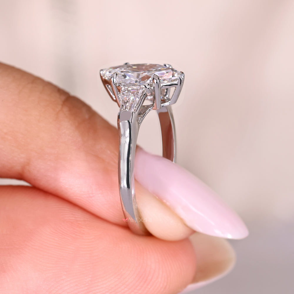 Marquise ring with two V prong and claw prongs.
