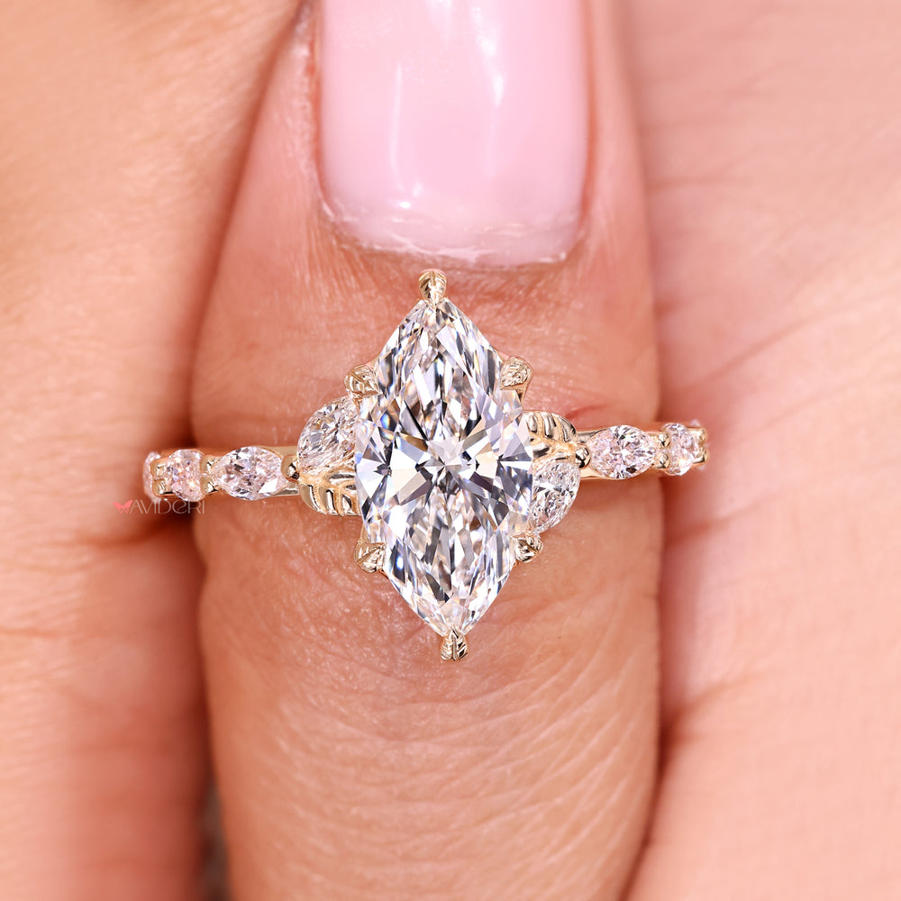Cathedral setting marquise diamond ring design.
