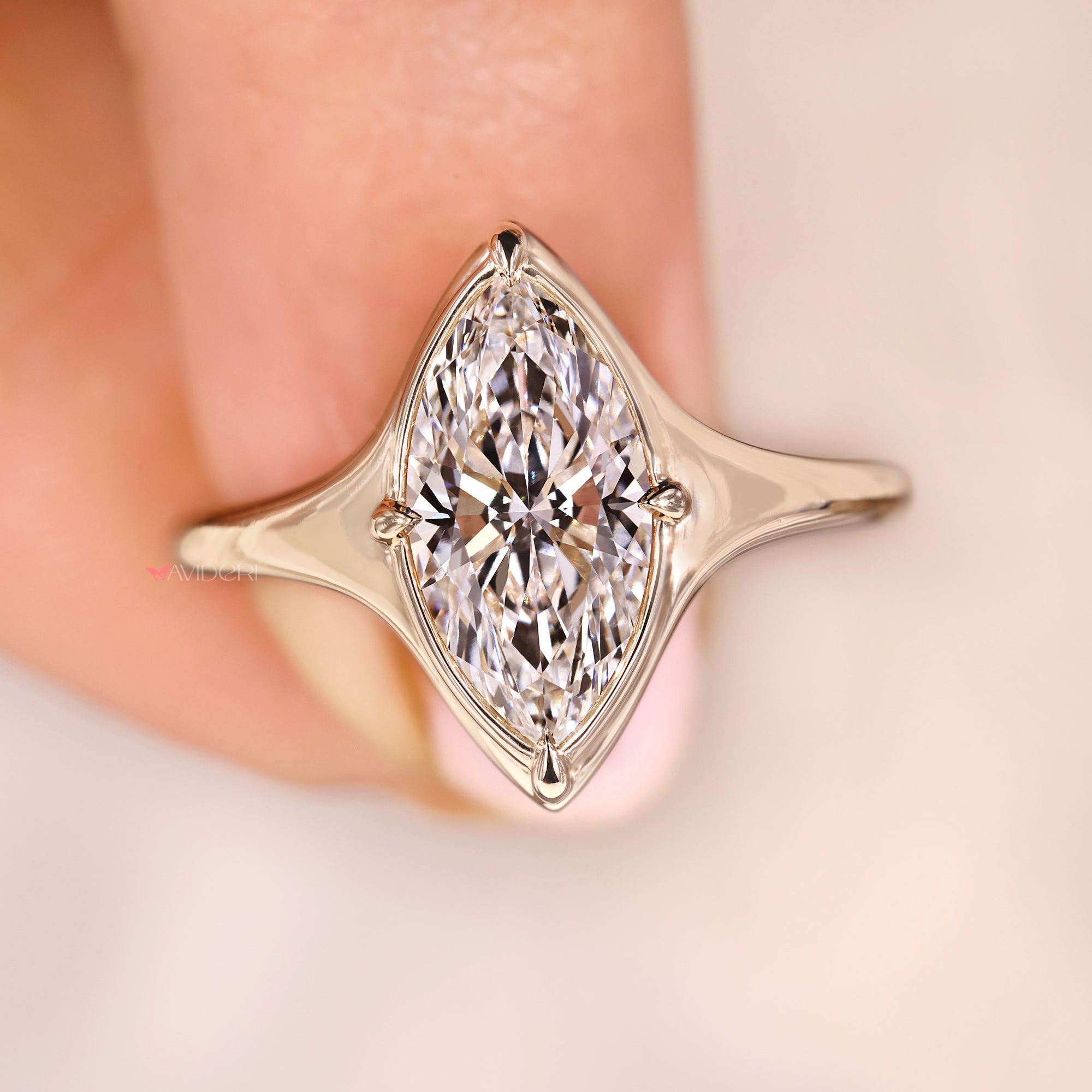 Handmade ring has bezel type prong setting.