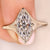 Handmade ring has bezel type prong setting.