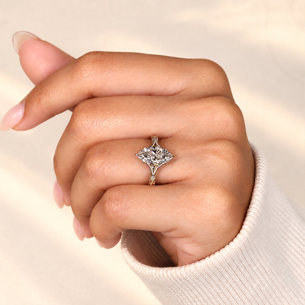 Marquise ring with split shank and claw prongs.
