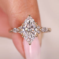 Marquise Cut Diamond Ring with Round Side Stones