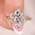 Marquise Cut diamond Ring with round cut side stones.
