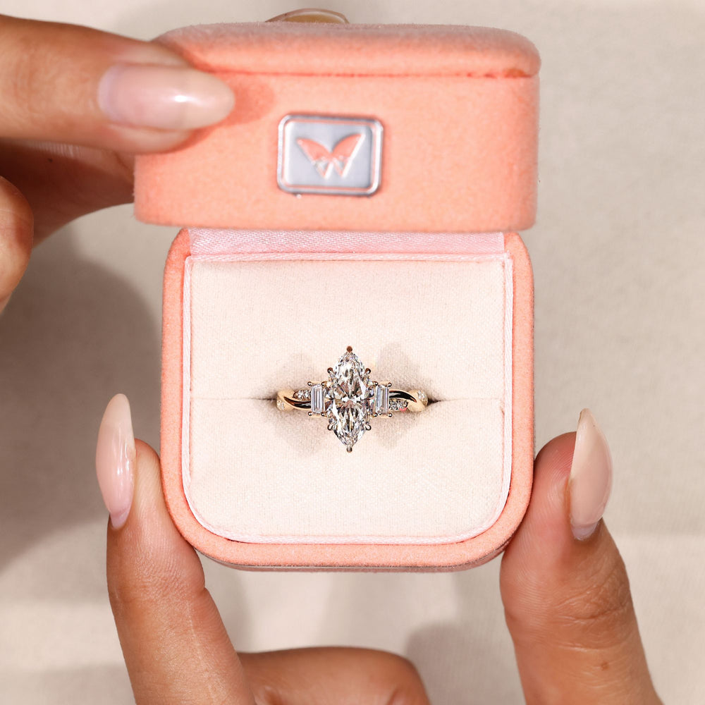 Handmade marquise ring with baguette side stones.
