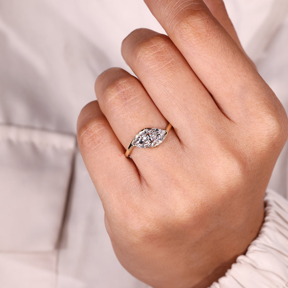 Solitaire marquise engagement ring prong set.
